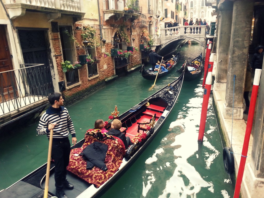 Couples taking a gondola ride in Venice, Italy