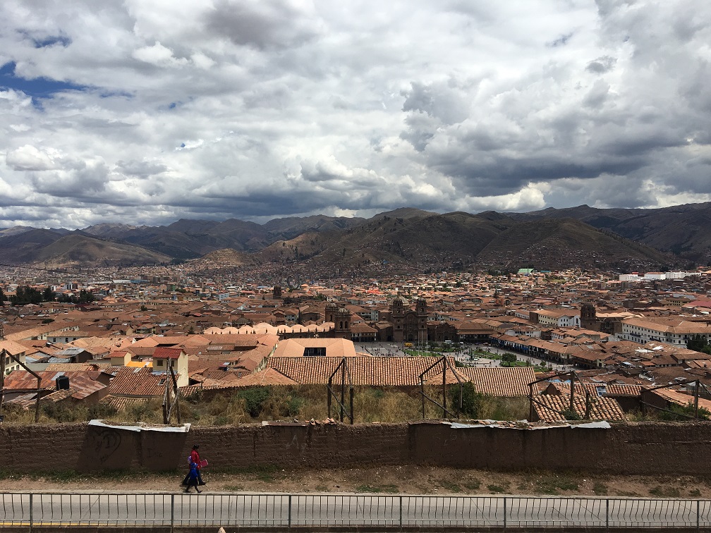 Mother walking her child home after school in Cusco, Peru