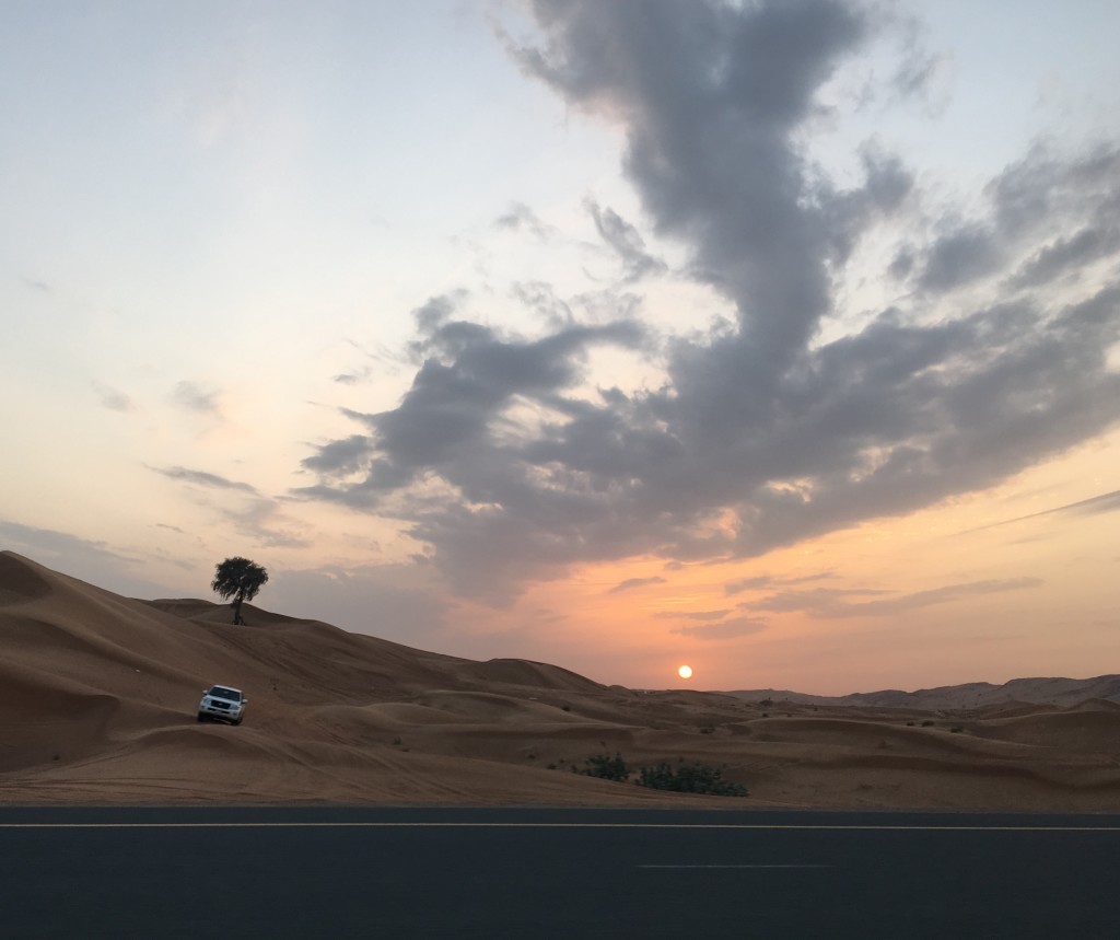 Dubai sand dunes at sunset
