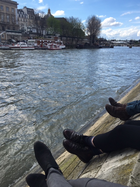 Sitting with friends along the River Seine