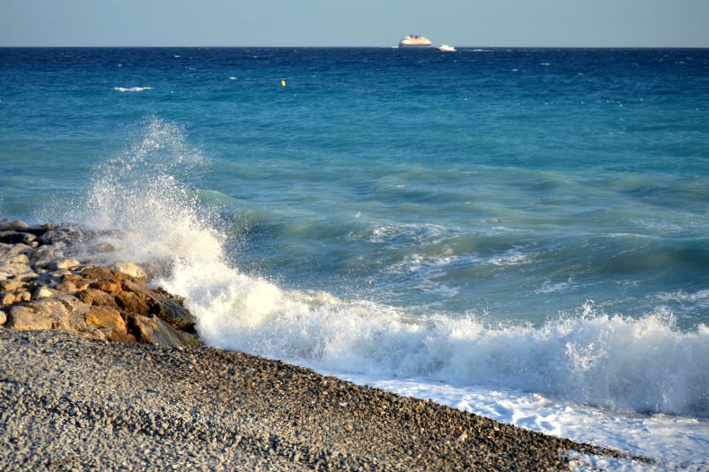 Waves crashing along the shore in Nice, France