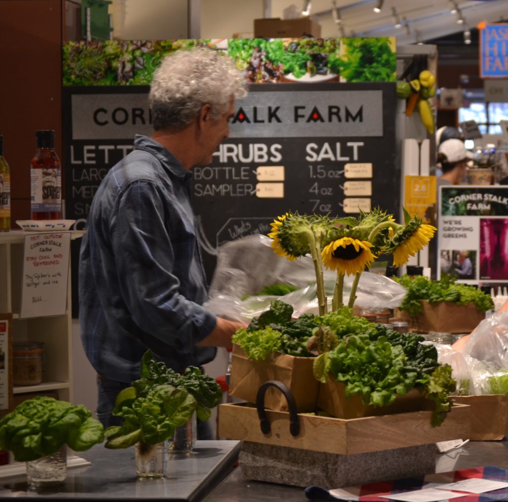 Farmer selling fresh produce at the Boston Public Market