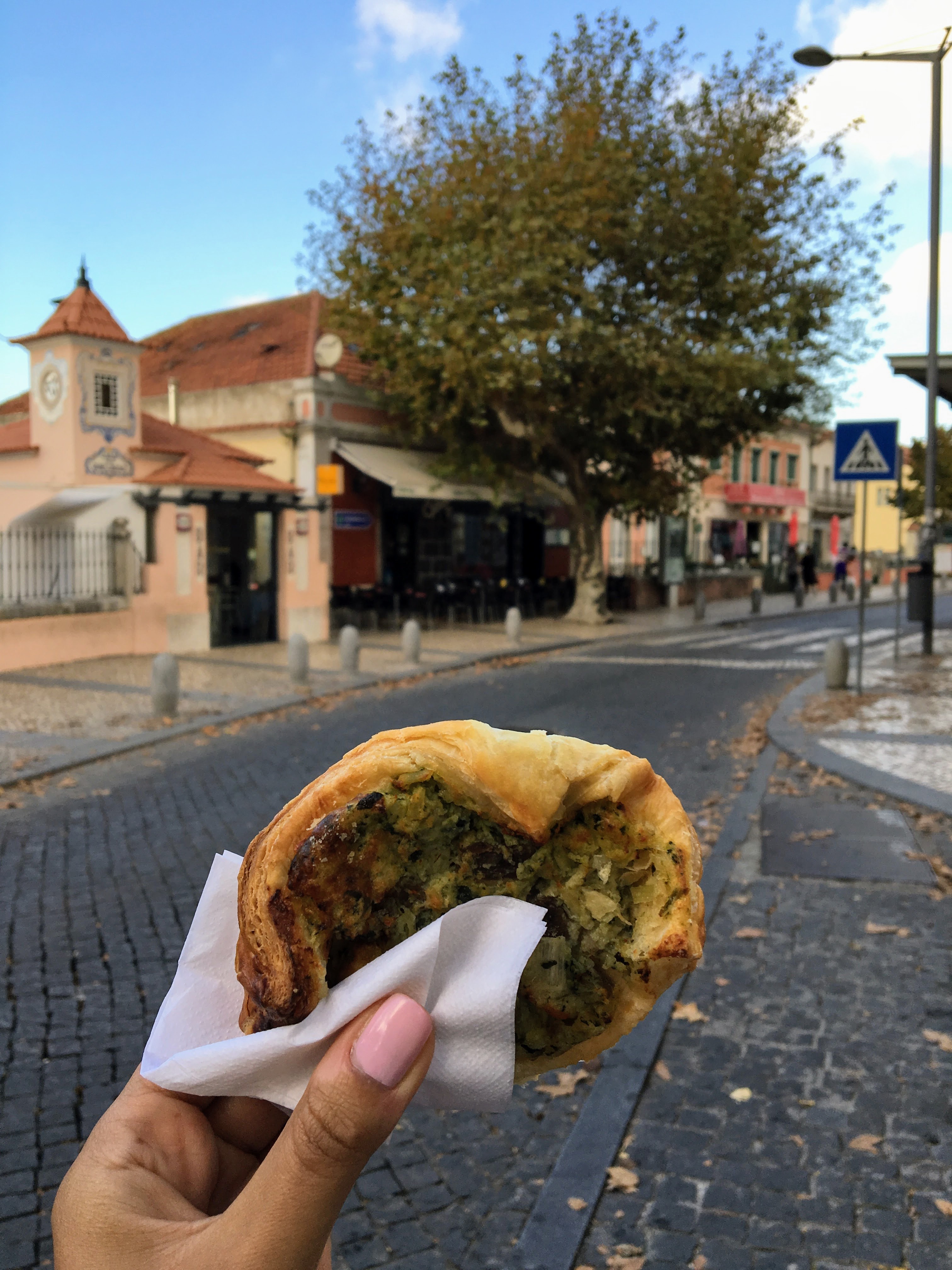 Eating a savory danish in Sintra, Portugal
