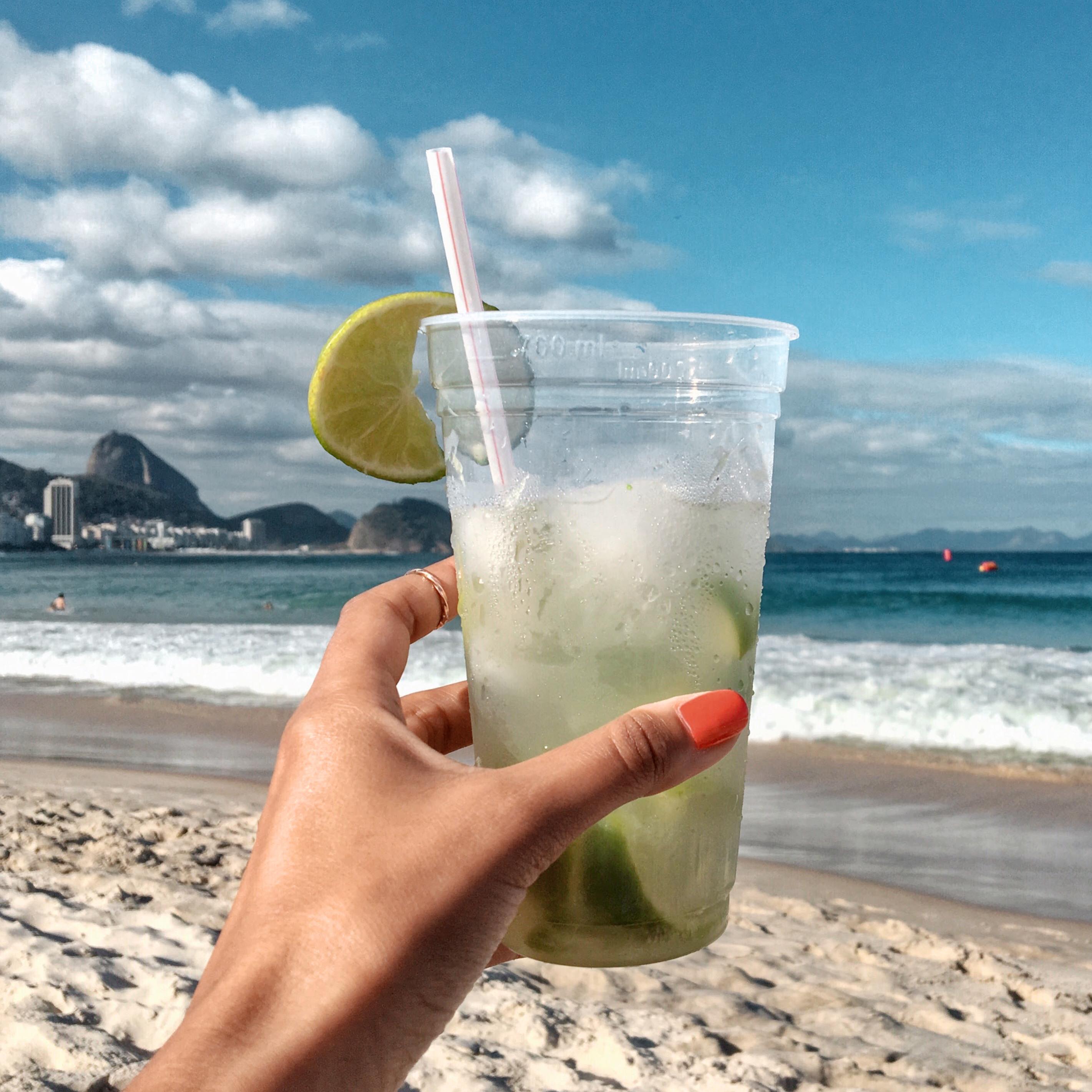 Brizilian caipirinha cocktail on Copacaban Beach in Rio De Janeiro