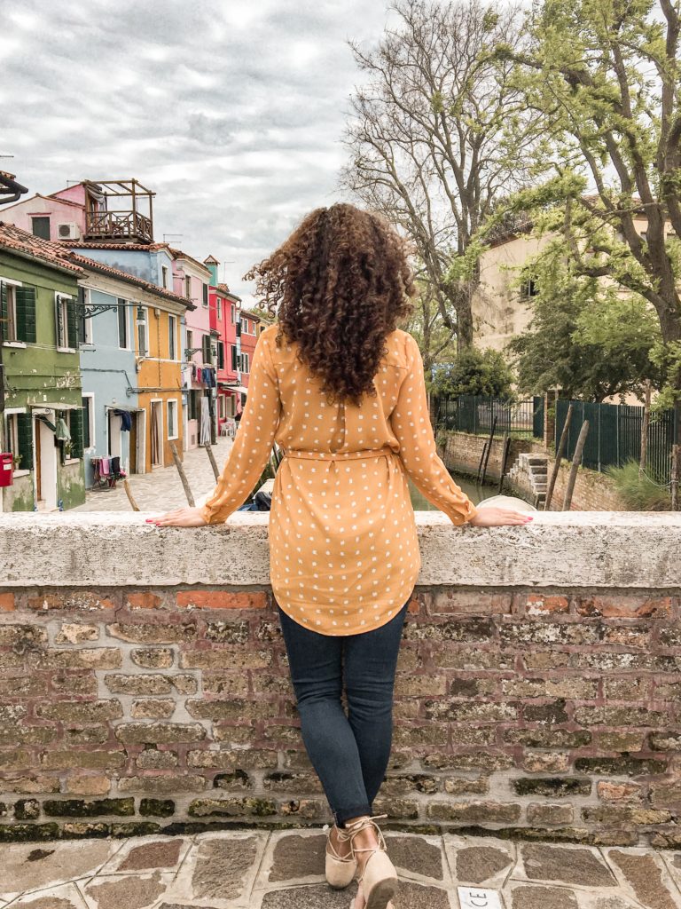 Standing on a bridge in Burano Italy