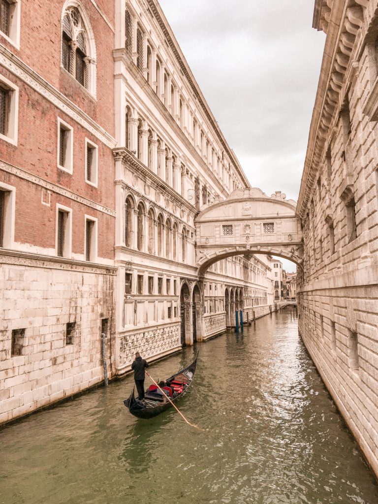 Gondola ride on the canal in Venice Italy